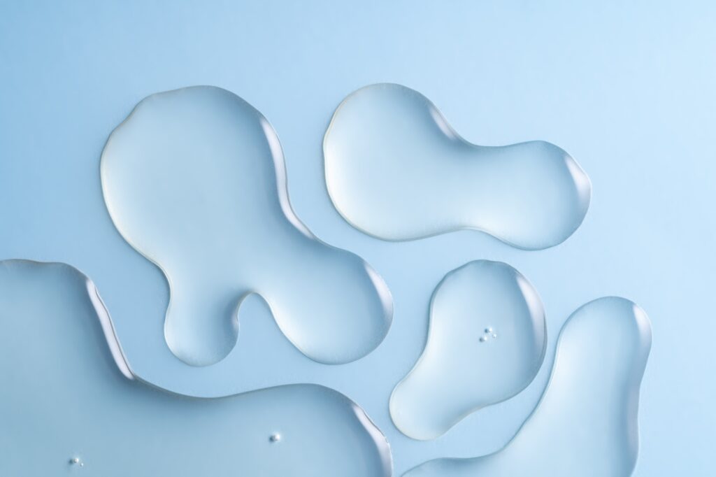 Close up Clear liquid cosmetic product. Gel texture with bubbles, skin care product